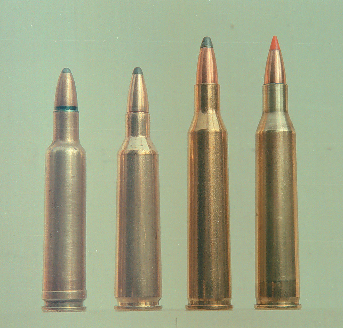 Comparative factory cartridges include: (1) .224 Weatherby Magnum, (2) .22-250 Remington and (3) .220  Swift. Note the sharper profile of the fireformed .220 Swift handload (4).